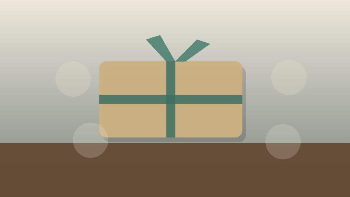 A wrapped retail loyalty package with a ribbon on a clean wooden table in a boutique store.